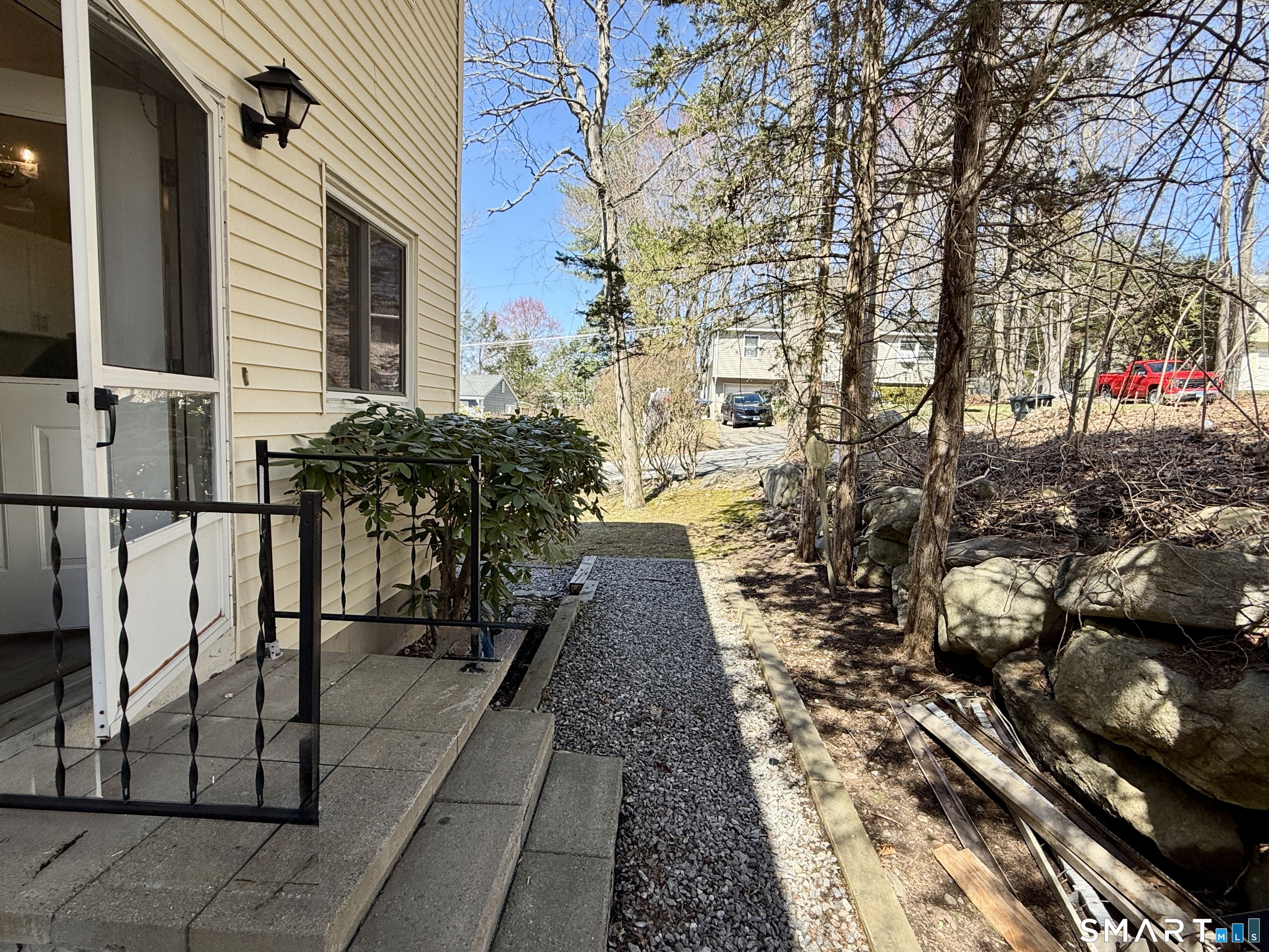 84 Wilmot Street Torrington, CT 06790 - Photo 15 of 18 a view of a pathway that has the potted plants