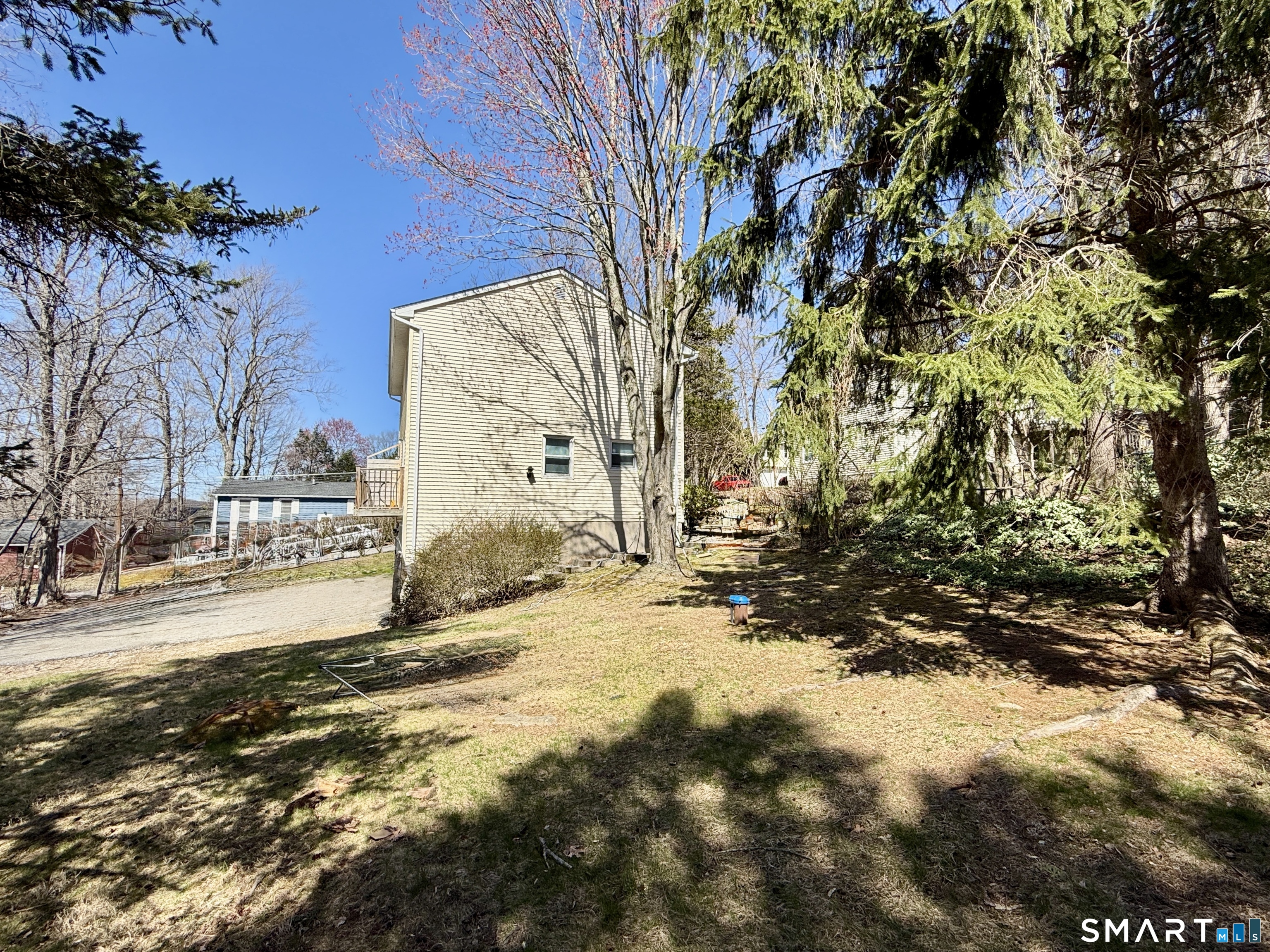 84 Wilmot Street Torrington, CT 06790 - Photo 17 of 18 a view of a yard with a tree