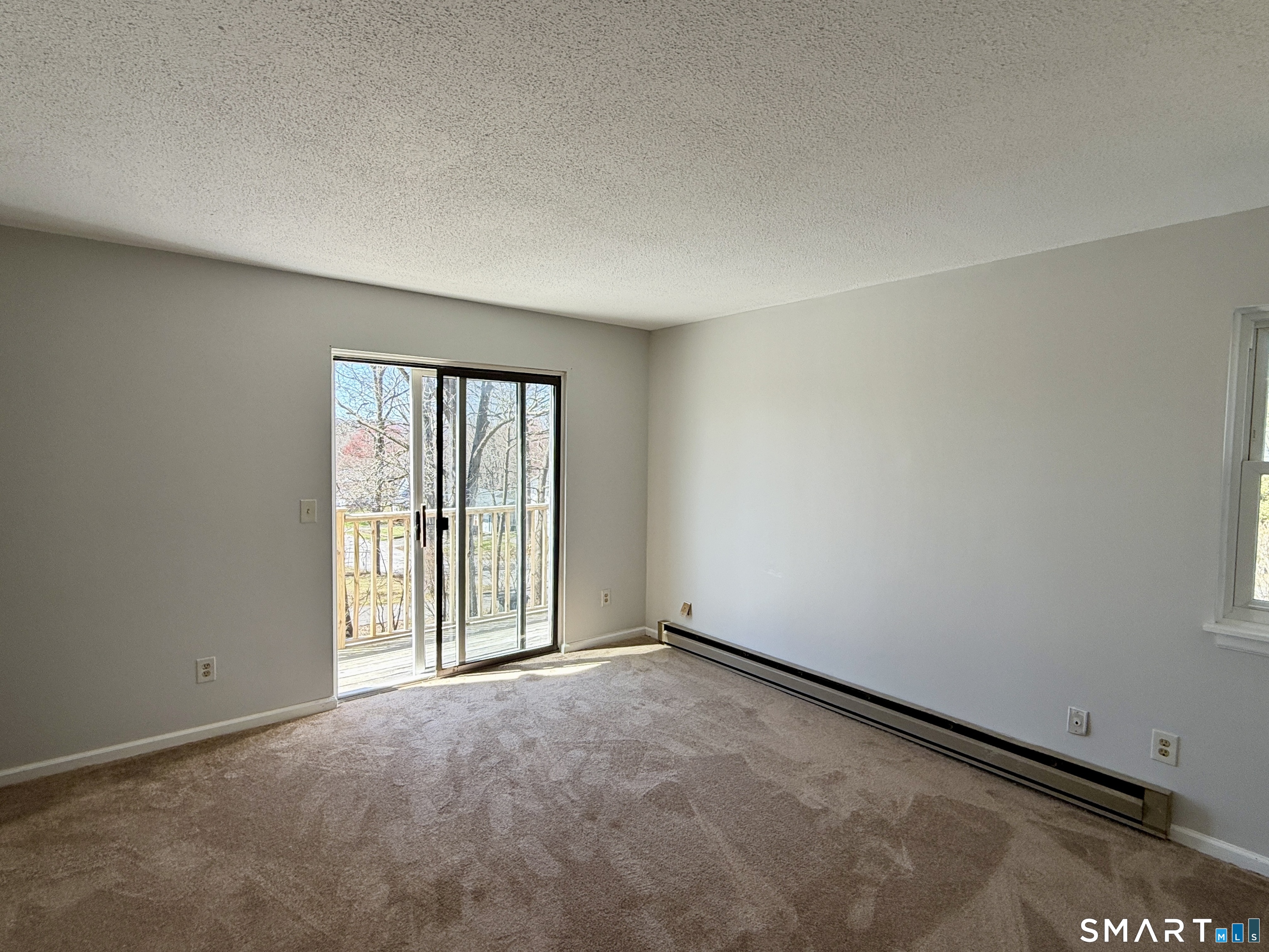 84 Wilmot Street Torrington, CT 06790 - Photo 5 of 18 an empty room with windows