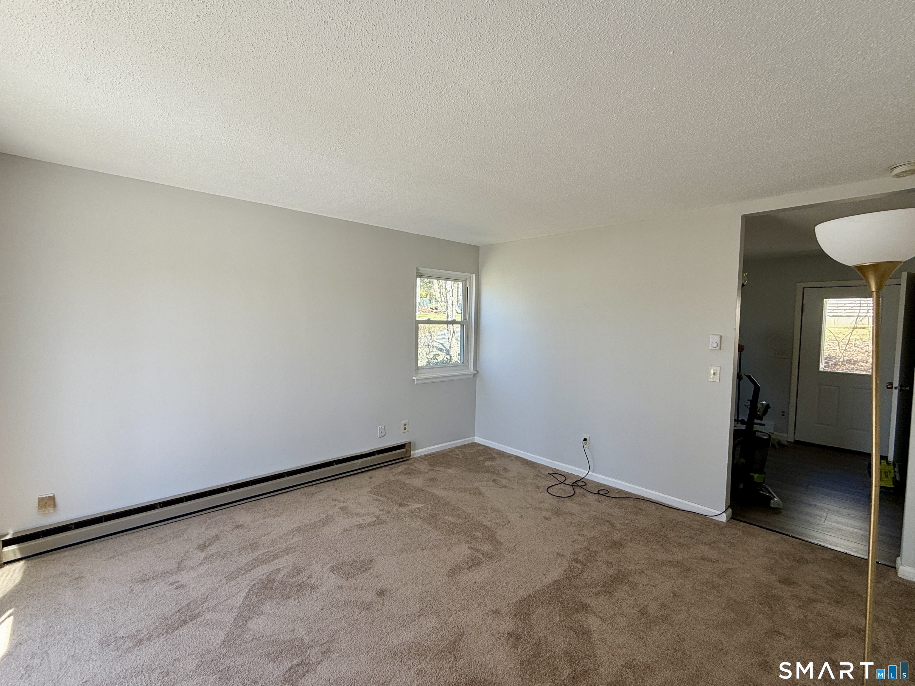84 Wilmot Street Torrington, CT 06790 - Photo 7 of 18 an empty room with windows