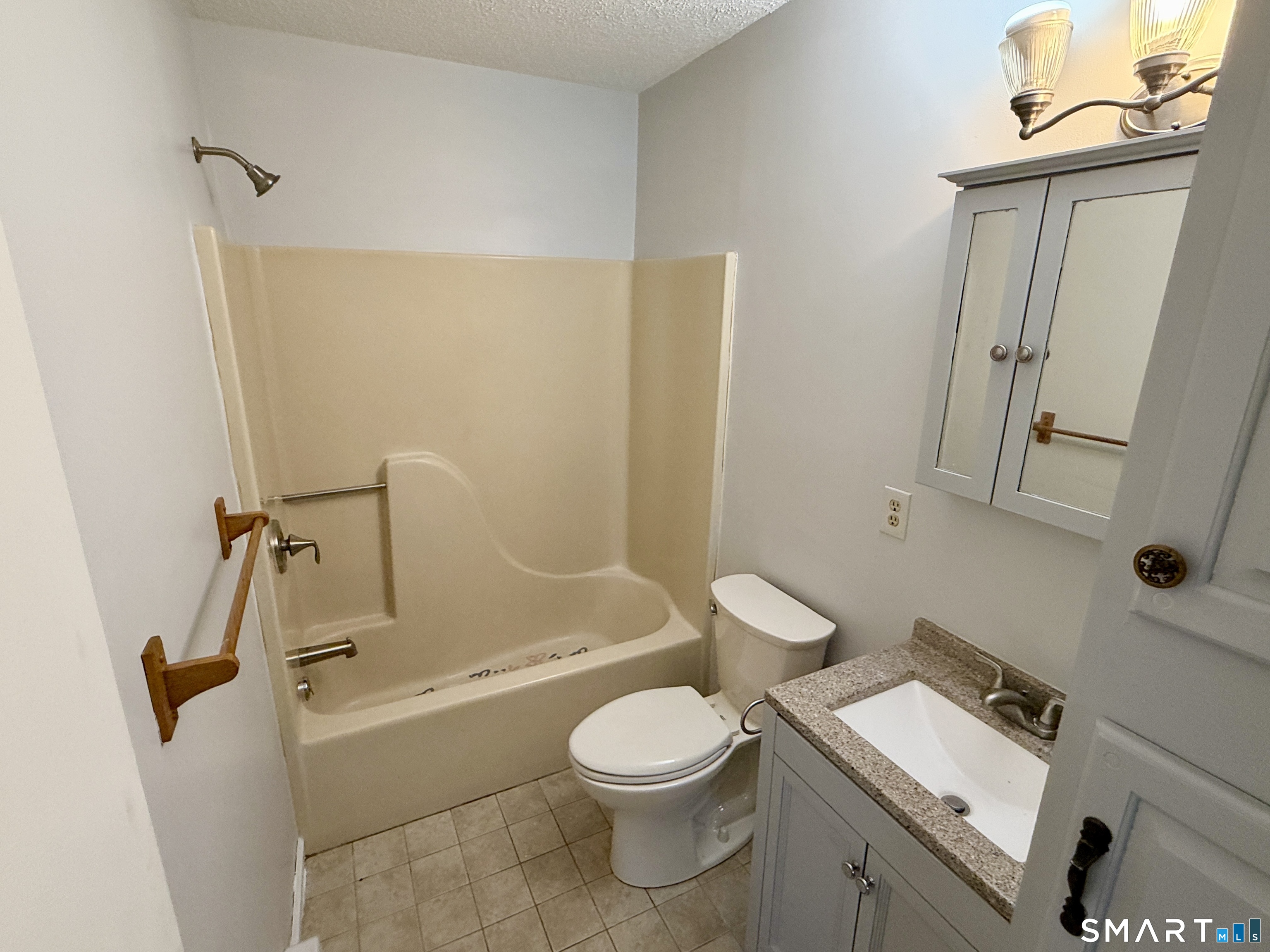 84 Wilmot Street Torrington, CT 06790 - Photo 8 of 18 a bathroom with a sink toilet and shower