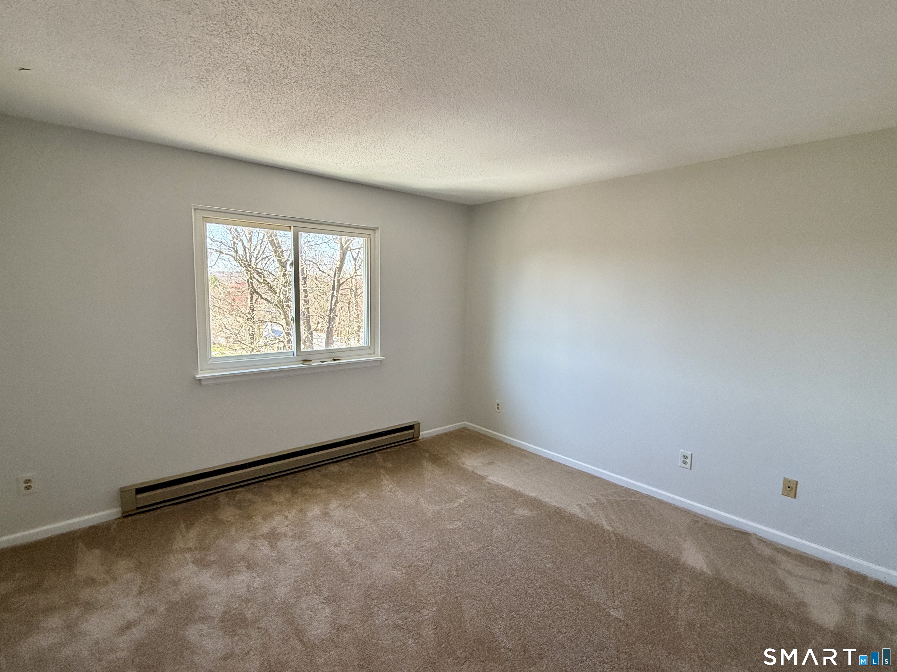 84 Wilmot Street Torrington, CT 06790 - Photo 9 of 18 an empty room with windows