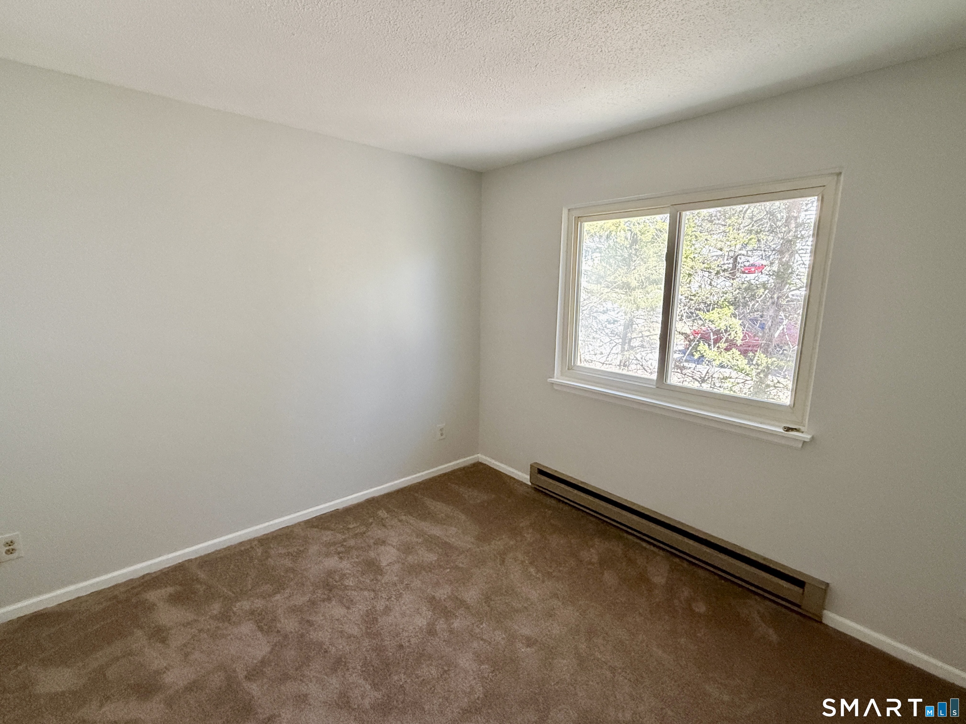 84 Wilmot Street Torrington, CT 06790 - Photo 10 of 18 an empty room with windows