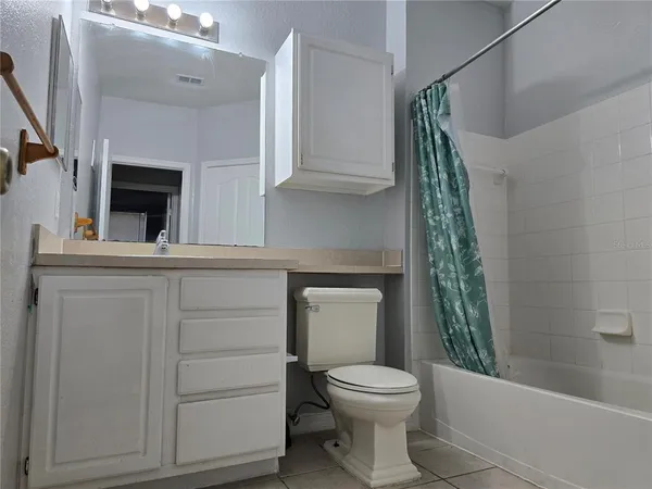 a bathroom with a toilet a sink and bathtub