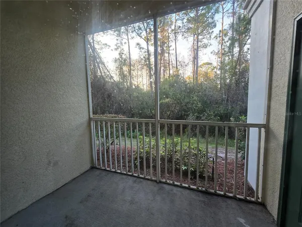 a view of a balcony with window