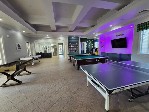 a room with gym equipment and a table