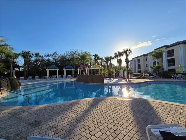 a view of a swimming pool with lounge chair