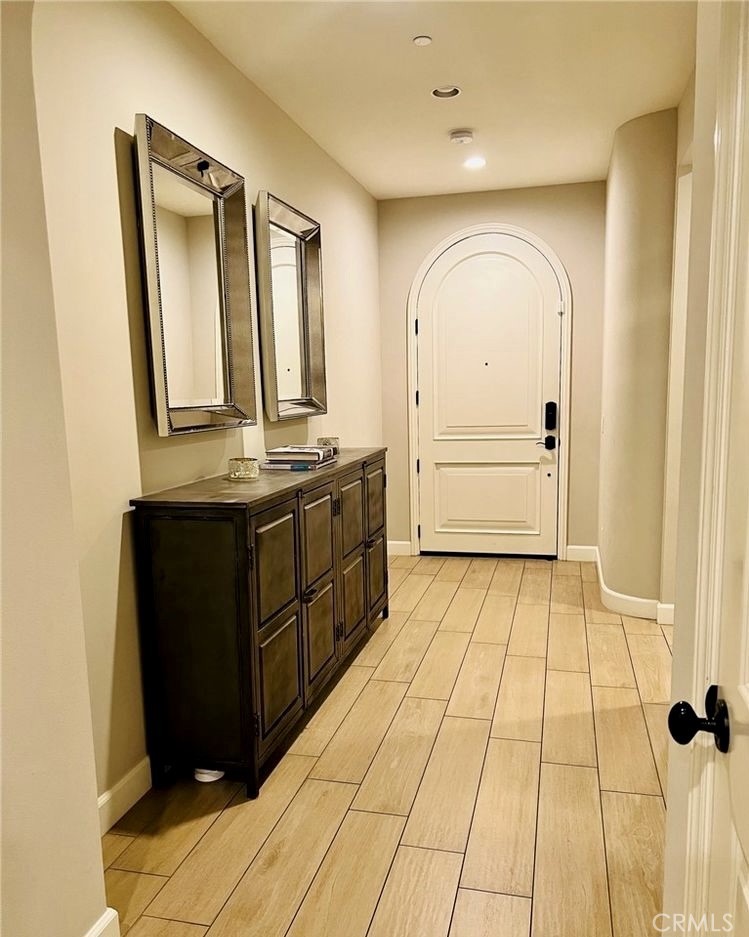 68 Chianti Irvine, CA 92618 - Photo 11 of 17 a view of a bathroom with mirror on the wall and a shower