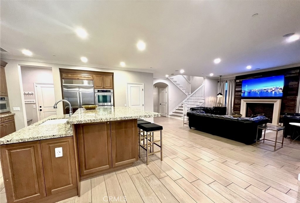 68 Chianti Irvine, CA 92618 - Photo 2 of 17 a kitchen with a sink cabinets and wooden floor
