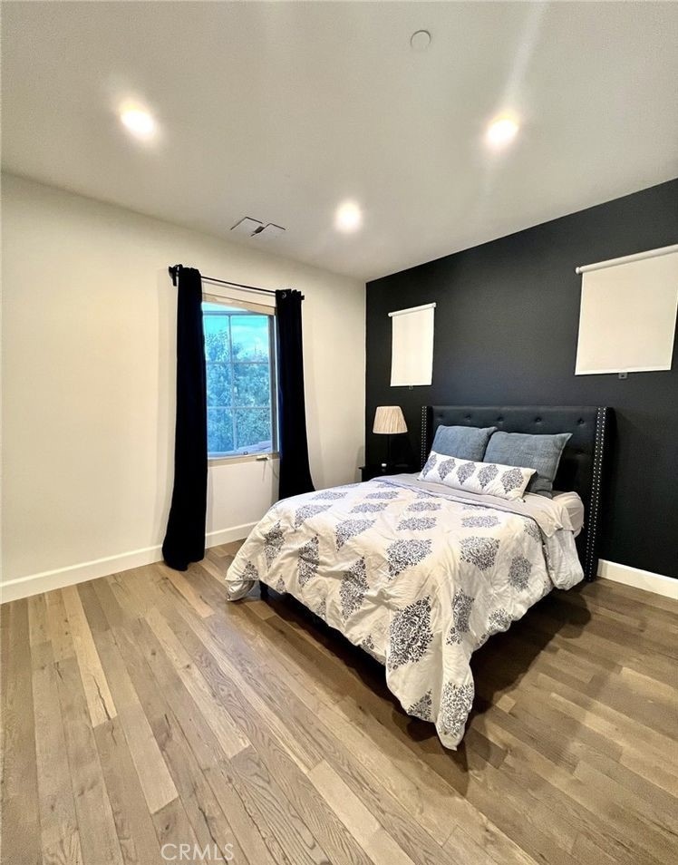 68 Chianti Irvine, CA 92618 - Photo 8 of 17 a bedroom with a large bed and a large window