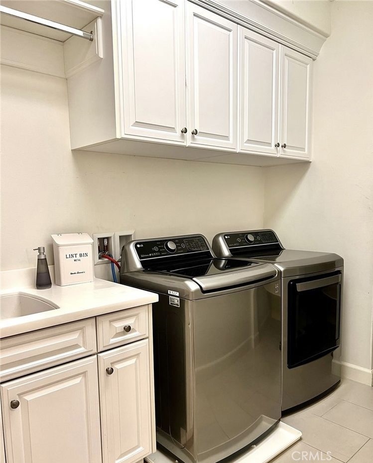 68 Chianti Irvine, CA 92618 - Photo 10 of 17 a kitchen with stainless steel appliances granite countertop a sink stove and cabinets