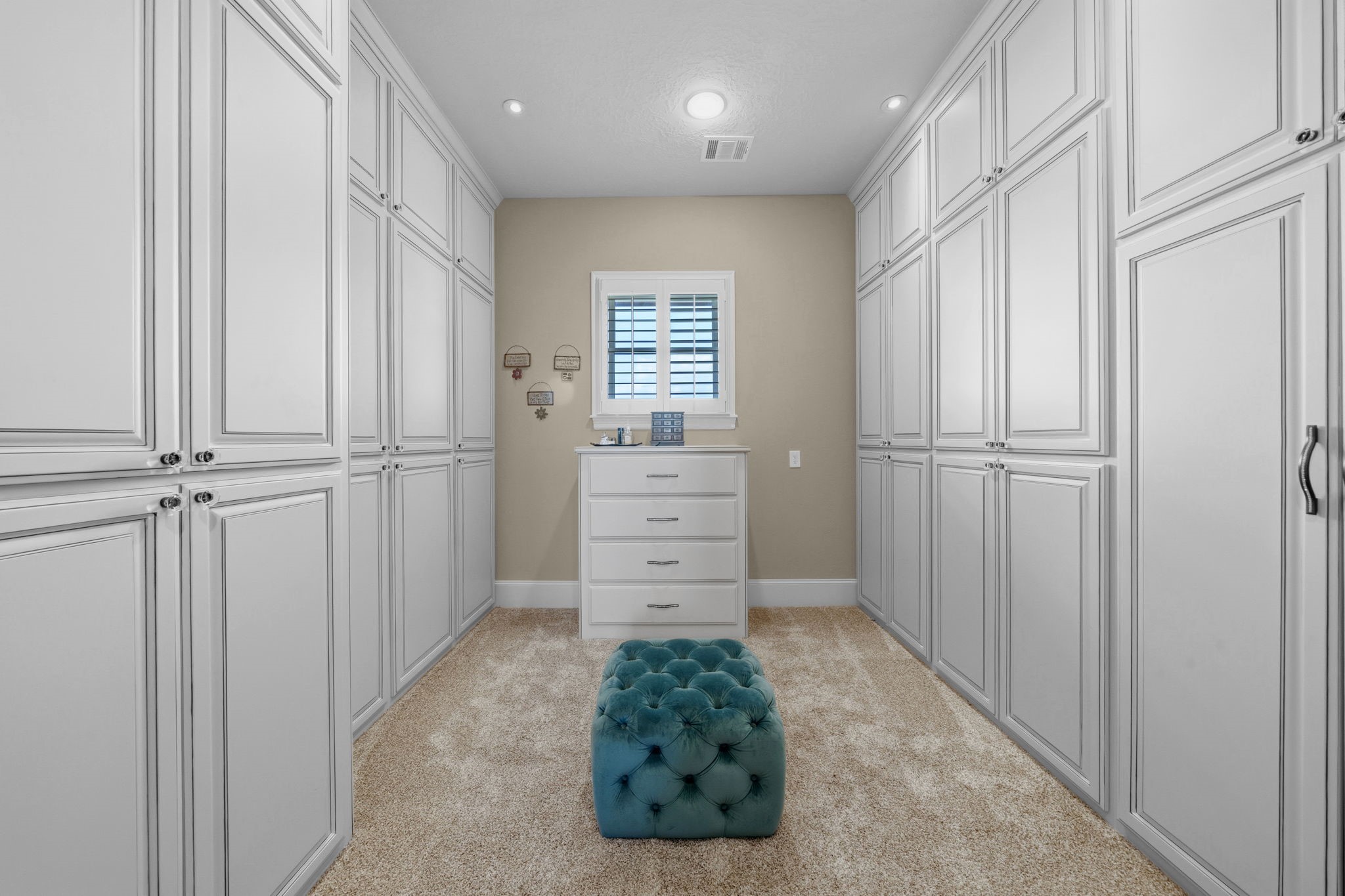 21620 Schiel Road Cypress, TX 77433 - Photo 23 of 49 This primary closet is equipped with floor to ceiling cabiets to protect clothing and accessories from light and dust.