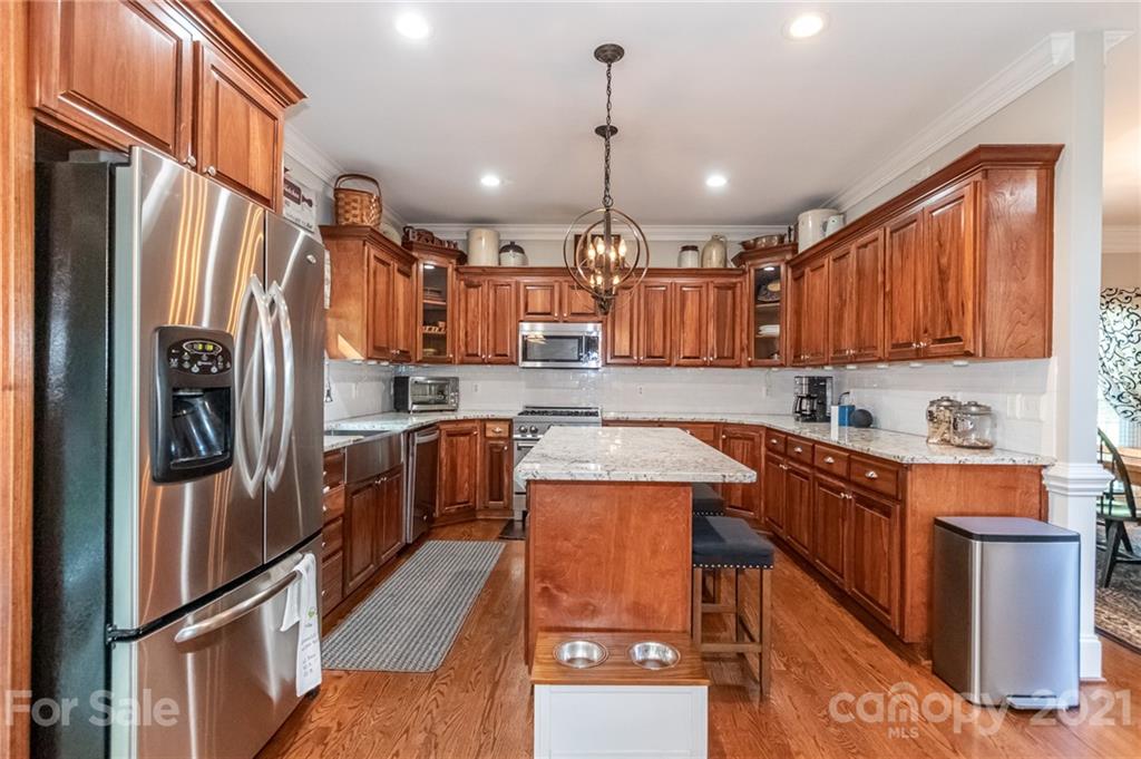 933 Ashford Way Fort Mill, SC 29708 - Photo 14 of 48 a kitchen with stainless steel appliances granite countertop a refrigerator a sink and a stove