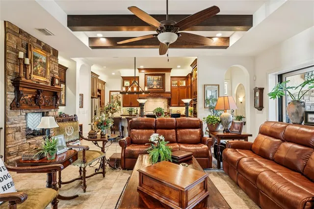 a spacious bedroom with a bed and wooden floor