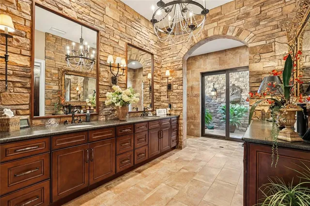 a bathroom with a sink a mirror and a window