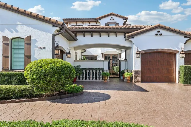 a potted plant sitting in front of a house