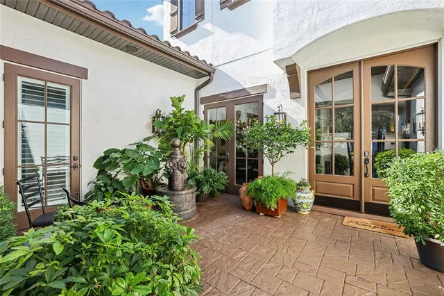 a view of a room with furniture and a chandelier