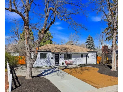 a view of a house with backyard porch and sitting area