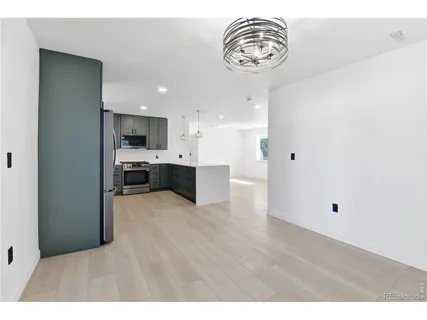 a view of kitchen with furniture and wooden floor