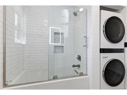 a bathroom with a bathtub and a shower