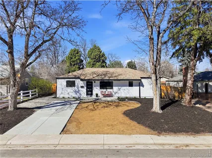 a front view of a house with yard patio and fire pit