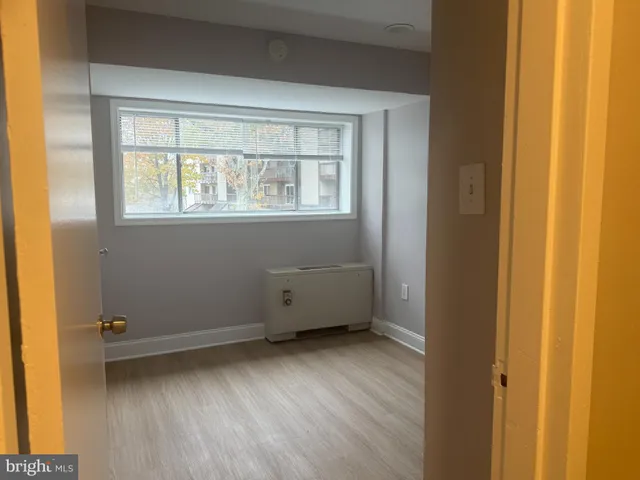 a view of a room that has a window in it