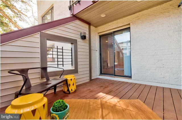 a view of a two chairs in the patio