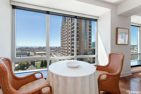 a dining room with furniture a window and outdoor view