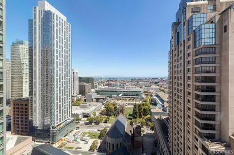 a view of a city with tall buildings