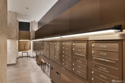 a living room with a couch and a glass door shower