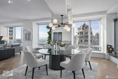 a spacious bedroom with a bed and a large window