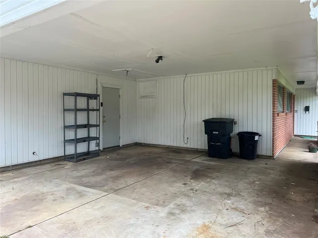 a view of an empty room with closet