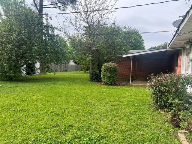 a view of a backyard with potted plants