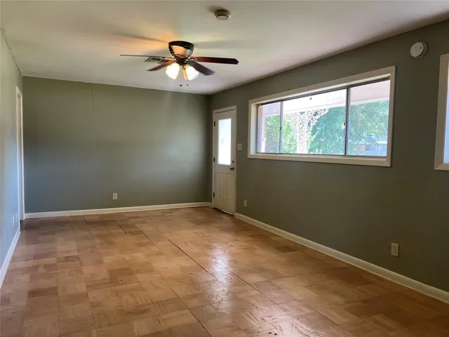 a view of an empty room with a window