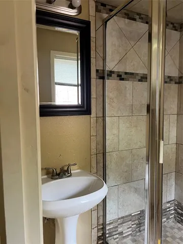 a bathroom with a sink and a window