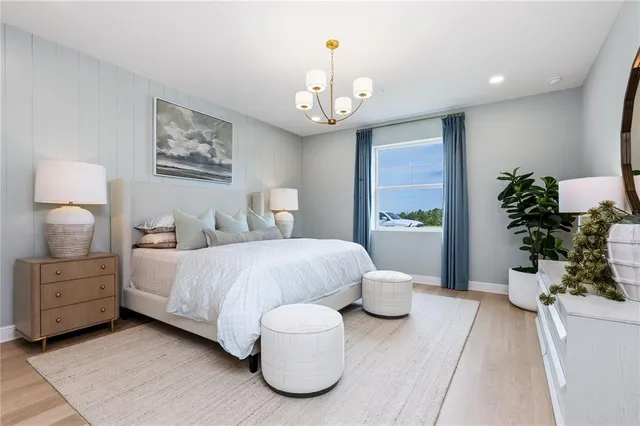 a bathroom with a double vanity sink toilet mirror and shower