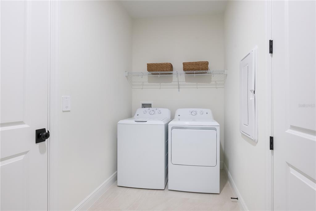 17841 Broadleaf Loop Venice, FL 34293 - Photo 17 of 19 a utility room with dryer and washer