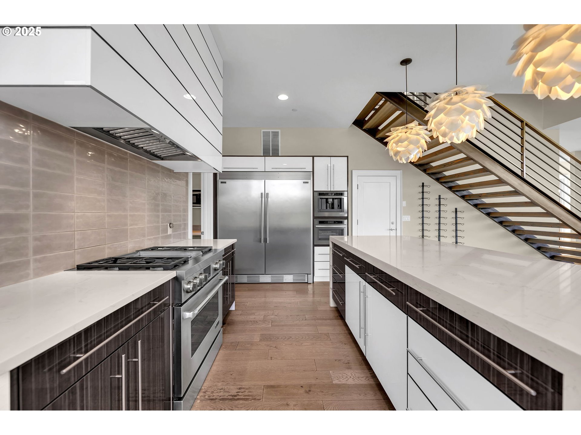 4645 North Adams Street Camas, WA 98607 - Photo 21 of 48 a kitchen with stainless steel appliances granite countertop a sink a stove and a refrigerator