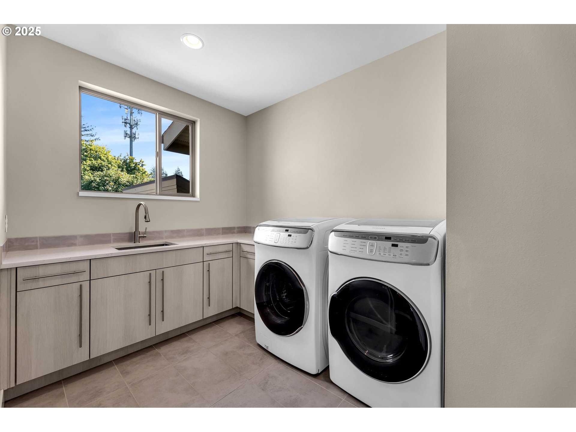 4645 North Adams Street Camas, WA 98607 - Photo 26 of 48 a view of a kitchen with sink washer and dryer