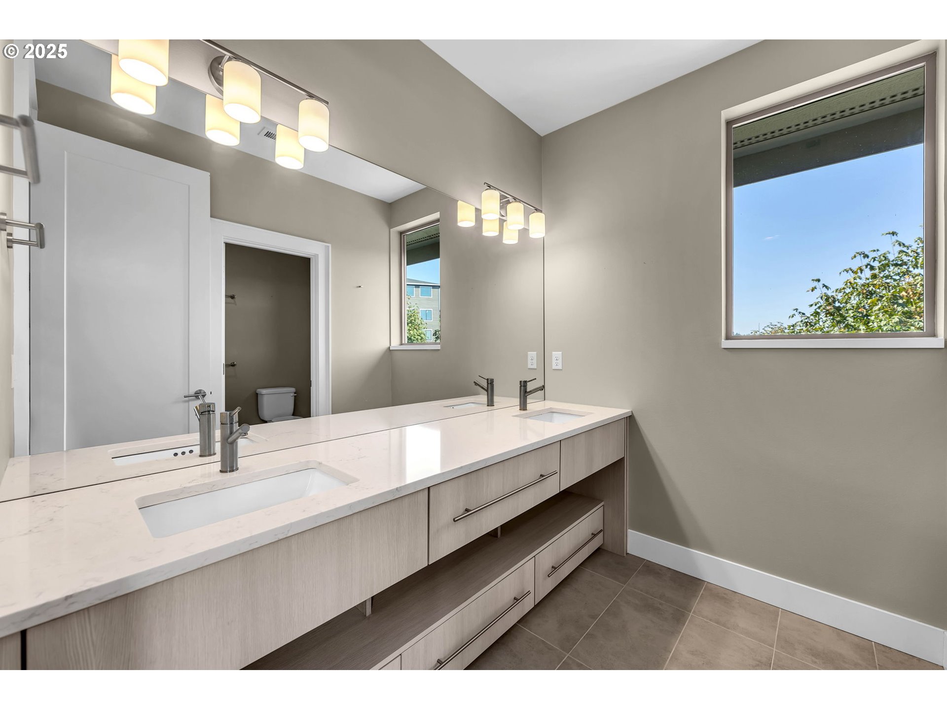 4645 North Adams Street Camas, WA 98607 - Photo 30 of 48 a bathroom with a double vanity sink and a mirror