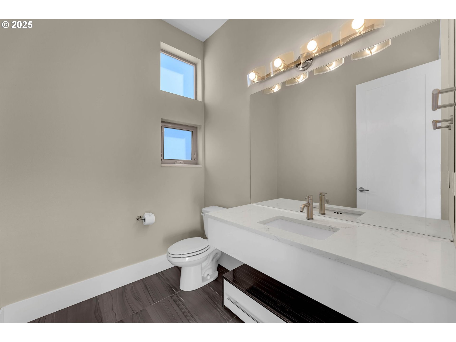 4645 North Adams Street Camas, WA 98607 - Photo 7 of 48 a bathroom with a sink a toilet and a mirror