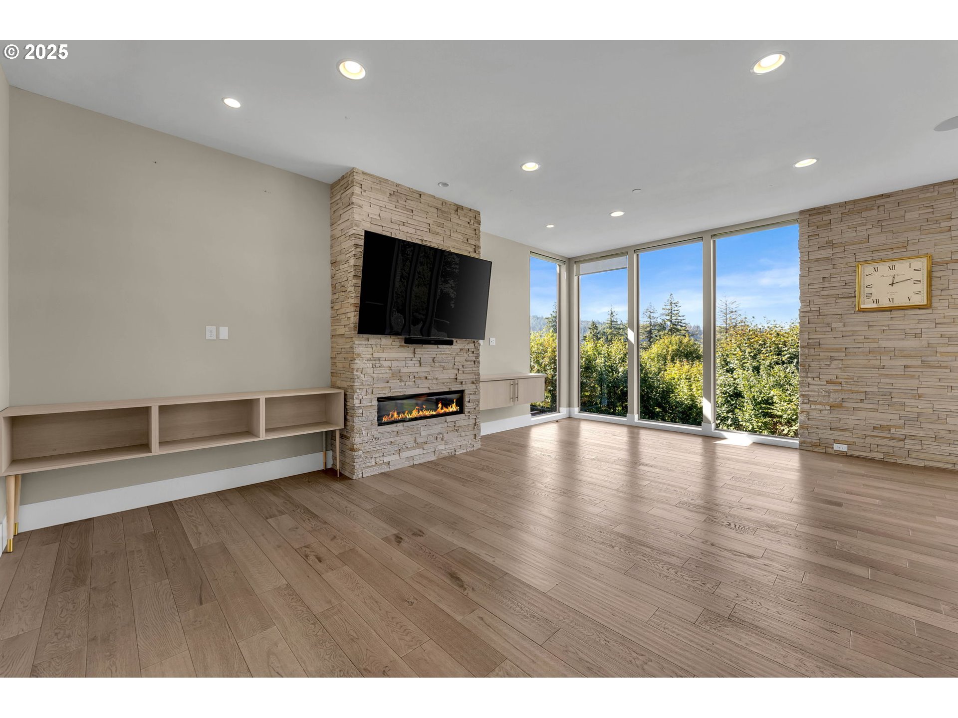 4645 North Adams Street Camas, WA 98607 - Photo 10 of 48 a view of a livingroom with wooden floor and flat screen tv