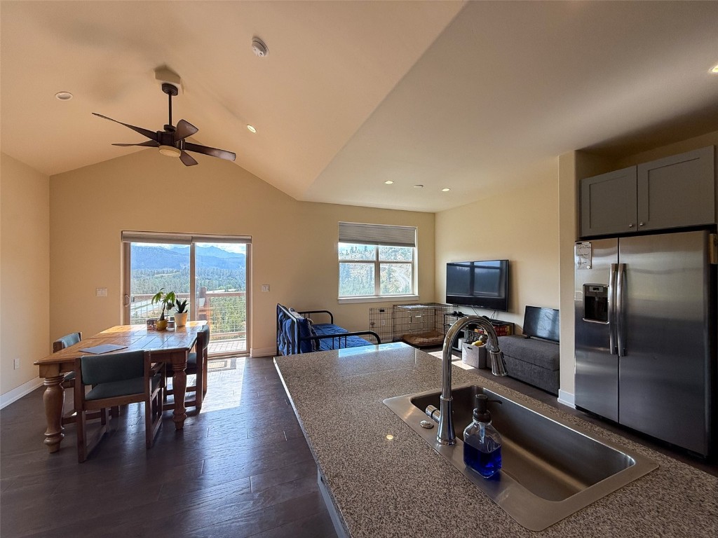 167 Wayback Drive, Unit 167 Keystone, CO 80435 - Photo 8 of 23 a living room with furniture and a flat screen tv
