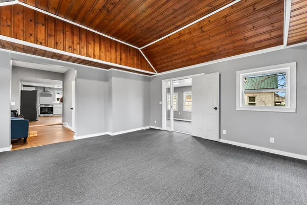 a view of an entryway with wooden floor
