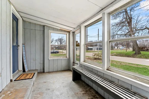 a room with furniture and large windows