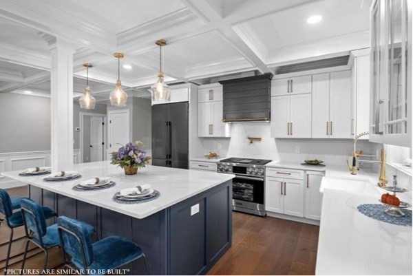 67 Everett Street Natick, MA 01760 - Photo 5 of 12 a kitchen with a sink stove and cabinets