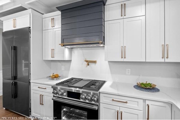 67 Everett Street Natick, MA 01760 - Photo 6 of 12 a stove top oven sitting inside of a kitchen