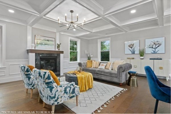 67 Everett Street Natick, MA 01760 - Photo 7 of 12 a living room with furniture a fireplace and a chandelier