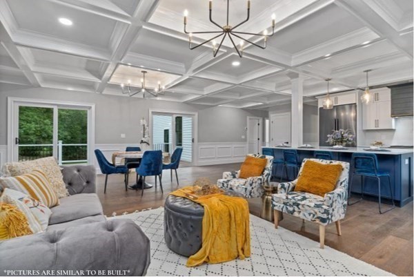 67 Everett Street Natick, MA 01760 - Photo 8 of 12 a living room with furniture and a chandelier