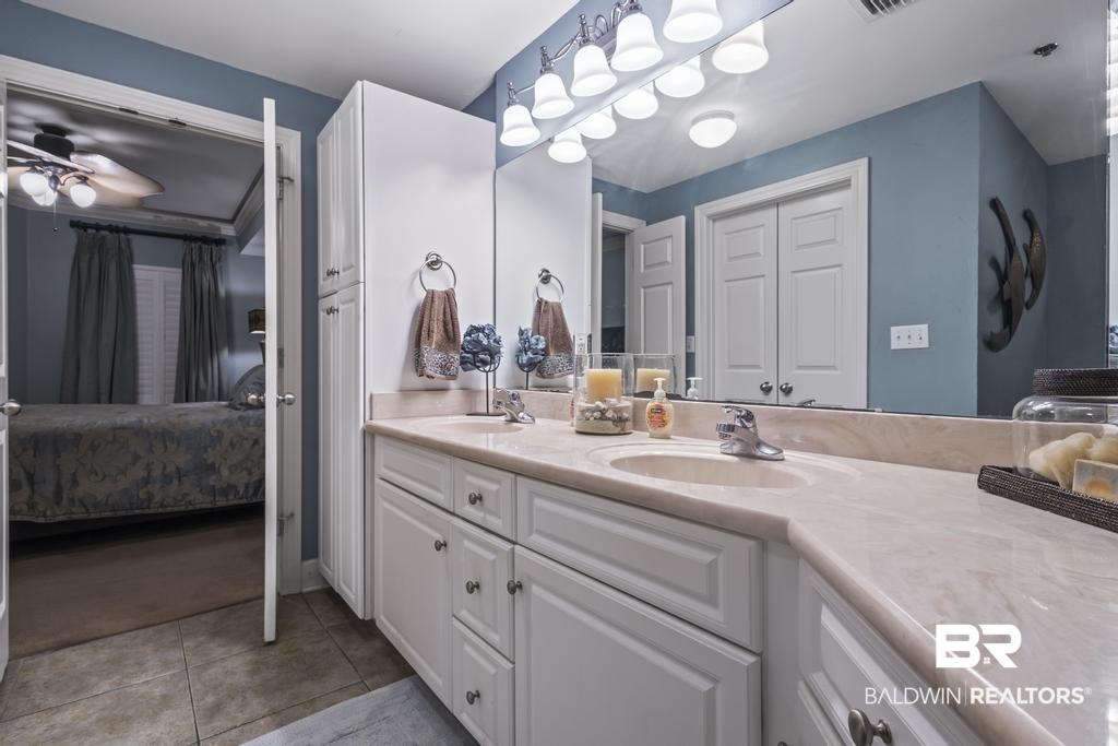 27582 Canal Road, Unit 2408 Orange Beach, AL 36561 - Photo 25 of 47 Bathroom with ceiling fan, double vanity, and tile patterned flooring